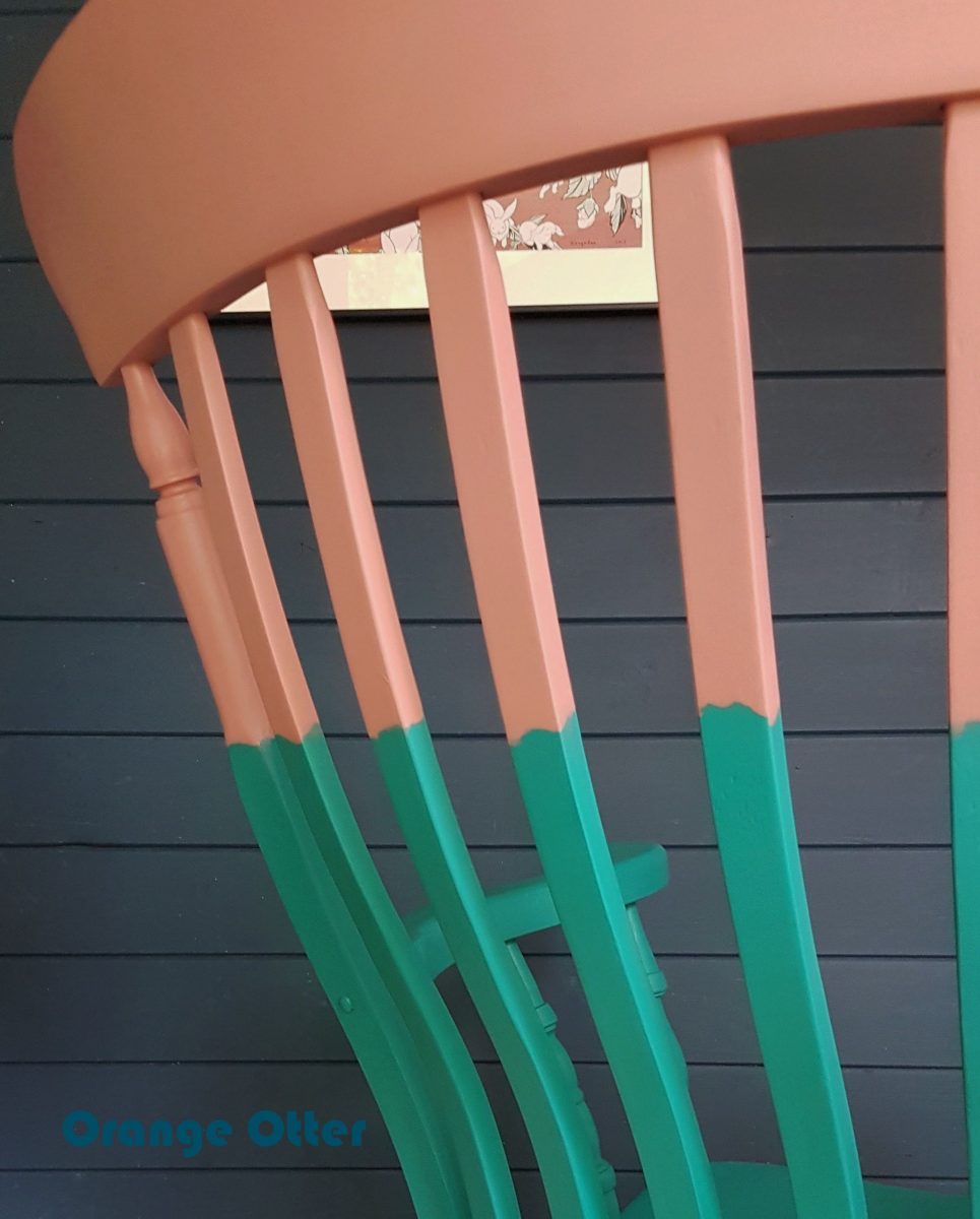 Two-tone teal and pink painted wooden rocking chair