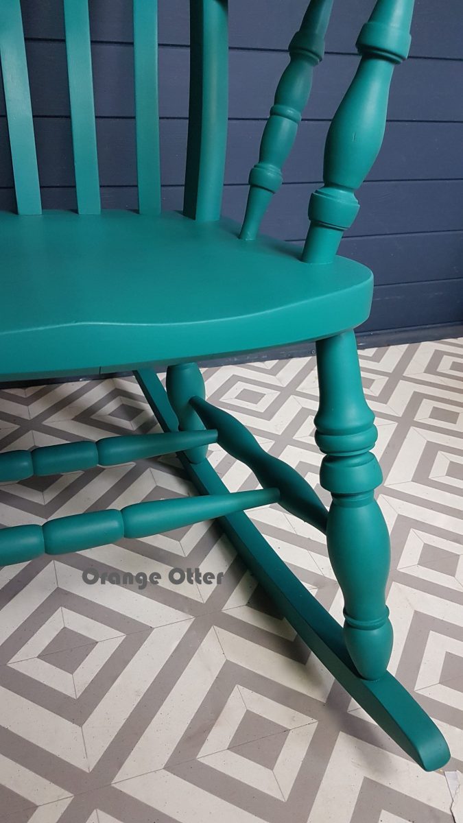 Two-tone teal and pink painted wooden rocking chair