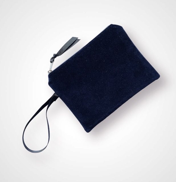 Luxury Navy Velvet Zip Up Pouch with blue Peacock Feathers hand printed design with golden shimmer and with Black Grosgrain hand strap