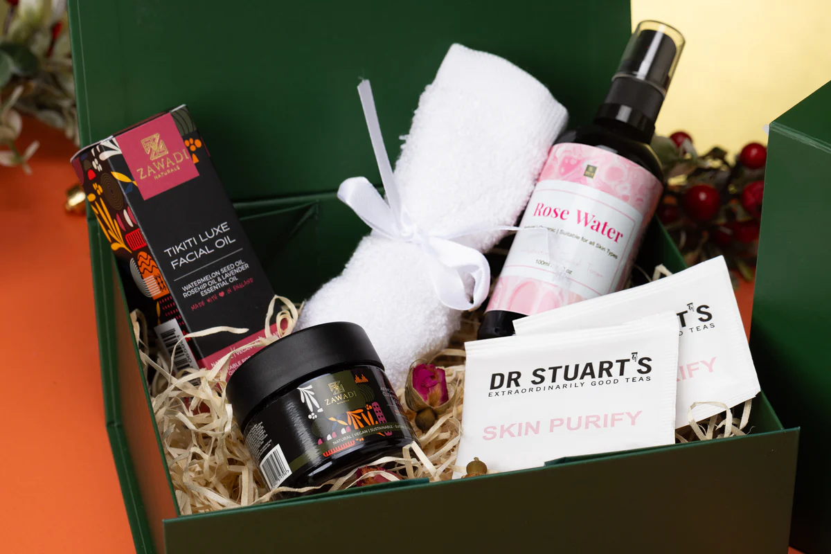 Spoil Her Self Love Gift Box featuring Makeda Glow Pot, Tikiti Luxe facial oil, a bamboo face towel, skin teas and natural skincare treats beautifully arranged in a box
