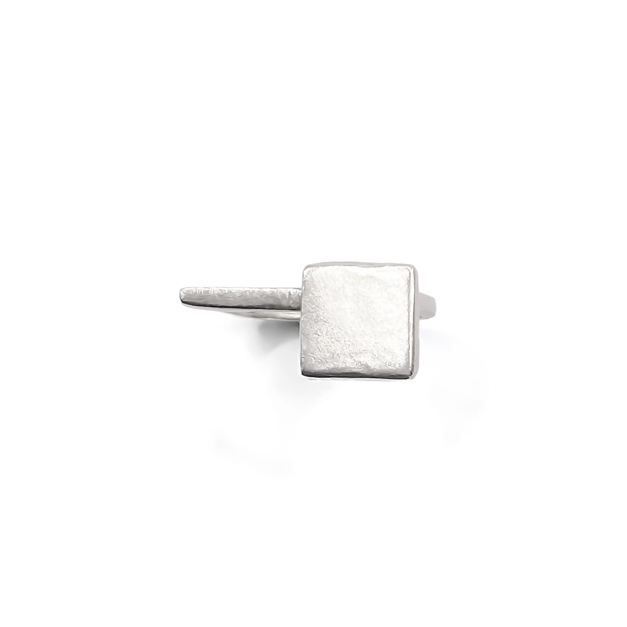 Sterling silver square-top signet ring on white background